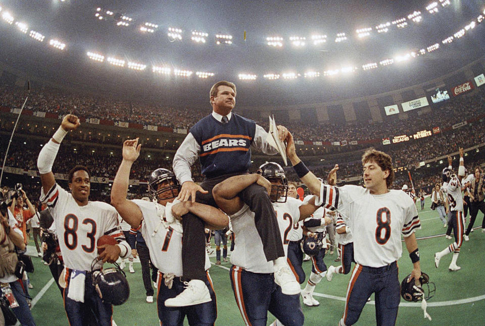 Chicago Bears coach Mike Ditka is carried off the field by Steve McMichael, left, and William Perry after the Bears defeated the New England Patriots 46-10 in Super Bowl XX. (AP Photo/Phil Sandlin, File)