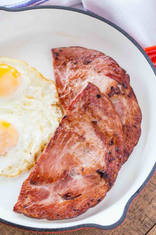 <p>Dinner Then Dessert</p><p>The perfect pairing with some sunny-side-up eggs and grits.</p><p><strong>Get The Recipe: <a href="https://dinnerthendessert.com/ham-steak/" rel="nofollow noopener" target="_blank" data-ylk="slk:Ham Steak;elm:context_link;itc:0;sec:content-canvas" class="link ">Ham Steak</a></strong></p>