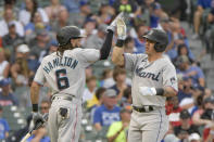 Miami Marlins' Billy Hamilton (6) congratulates Peyton Burdick, right, on Burdick's fifth-inning home run against the Chicago Cubs during a baseball game, Sunday, Aug. 7, 2022, at Wrigley Field in Chicago. (AP Photo/Mark Black)