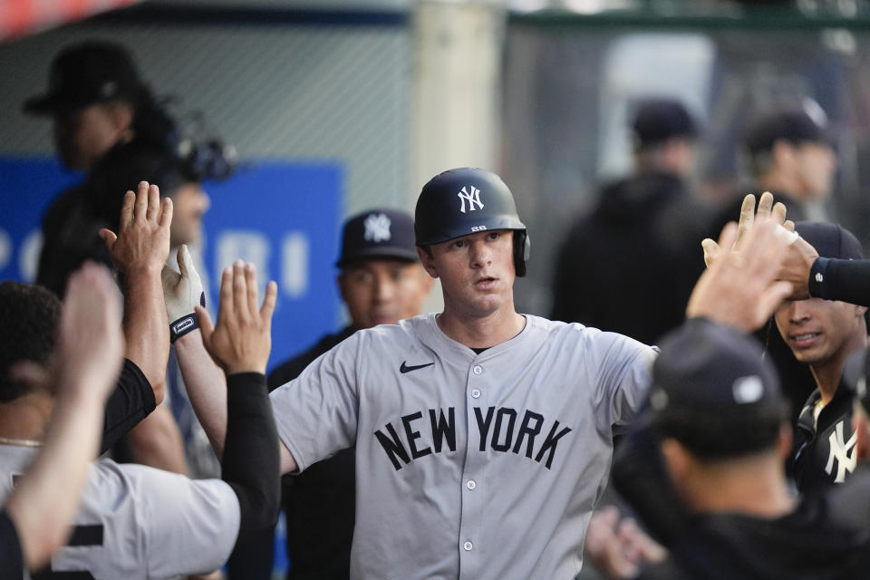 New York Yankees' DJ LeMahieu is congratulated in the dugout after scoring against the Los Angeles Angels during the fourth inning of a baseball game Tuesday, May 28, 2024, in Anaheim, Calif. (AP Photo/Ryan Sun)