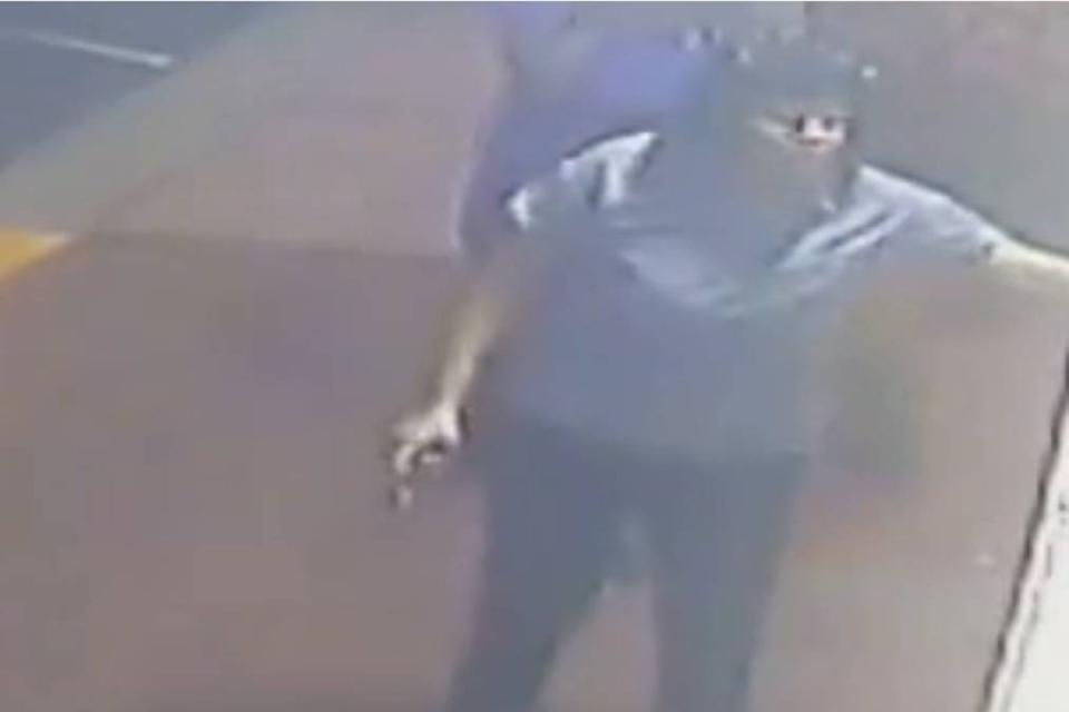 A McDonald’s employee is seen with a gun before shooting at a drive-thru customer (Lakeland Police)