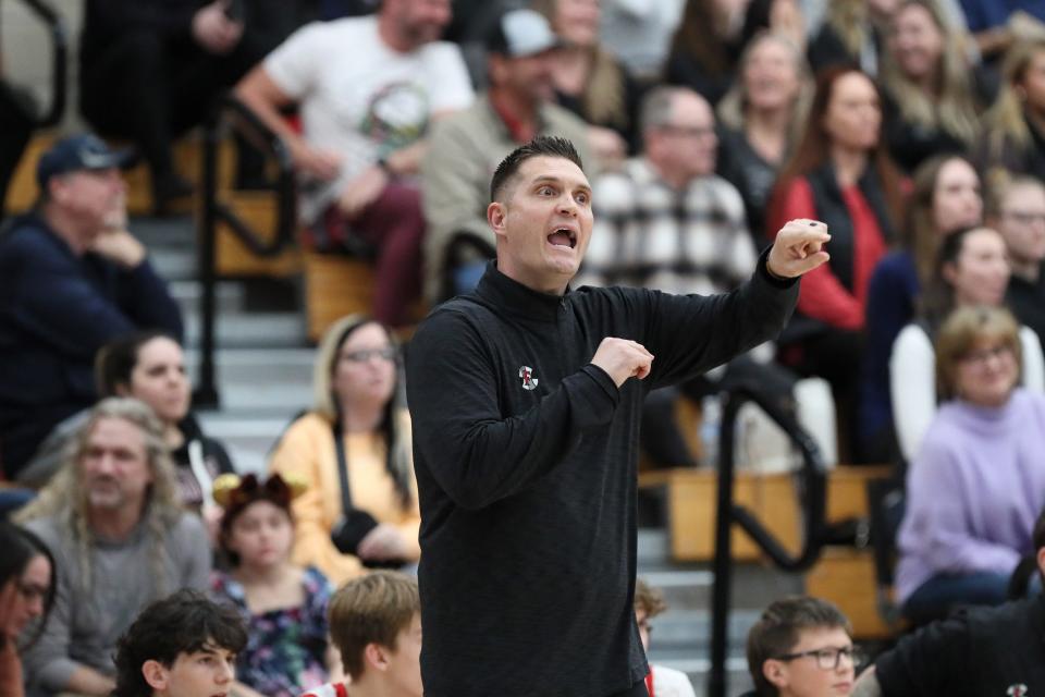 Foothill’s head coach, John Carter, directs a play to his players during the first quarter.