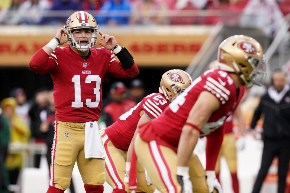 49ers quarterback Brock Purdy  signals in the first quarter against the Seahawks.