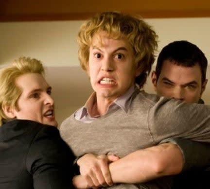 Carlisle and Emmett holding Jasper back before he kills Bella