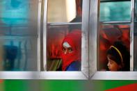 Rohingyas that will be shifted to Bhasan Char island are seen onboard a bus in Chattogram