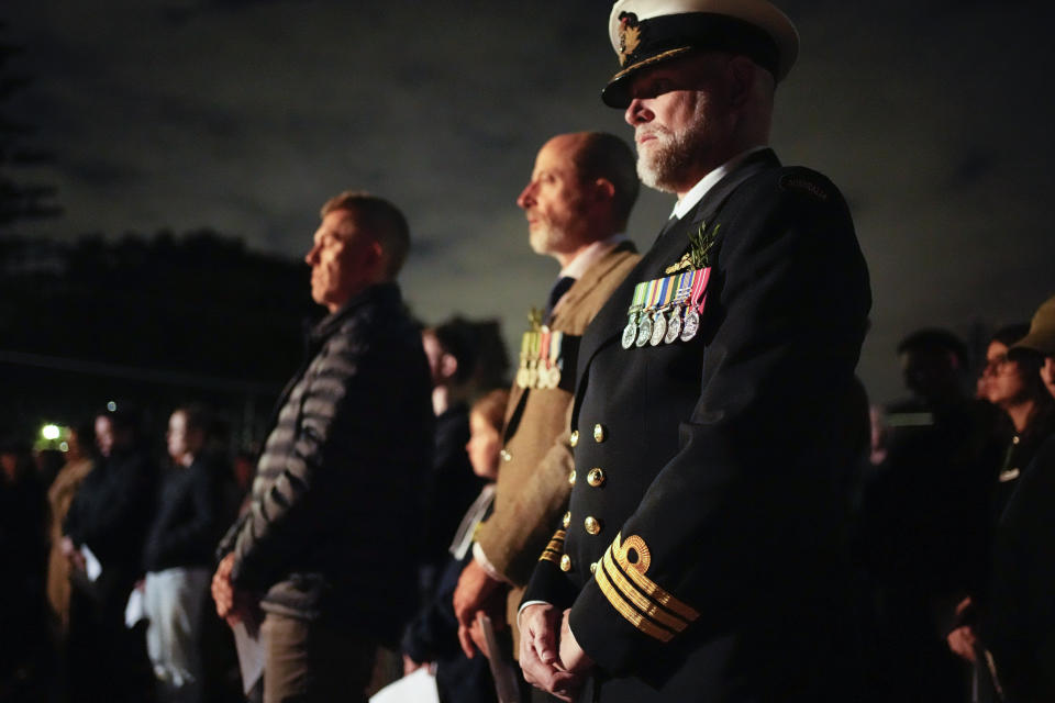 Veterans pause for a moment of silence during an Anzac Day dawn service at Waverley Cemetery in Sydney, Australia, Tuesday, April 25, 2023. (AP Photo/Mark Baker)