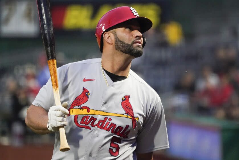 St. Louis Cardinals' Albert Pujols (5) warms up in the on deck circle before batting against the Pittsburgh Pirates.