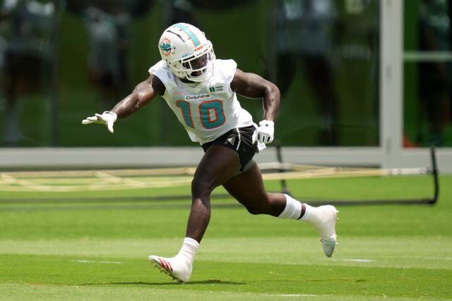 Dolphins receiver Tyreek Hill runs a drill in practice.
