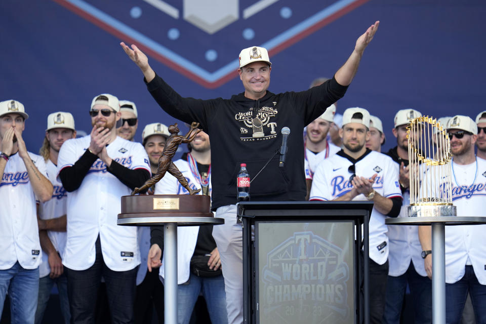 FILE - Texas Rangers general manager Chris Young (center) speaks to fans during baseball's World Series championship celebration on Nov. 3, 2023, in Arlington, Texas. (AP Photo/Julio Cortez, File)