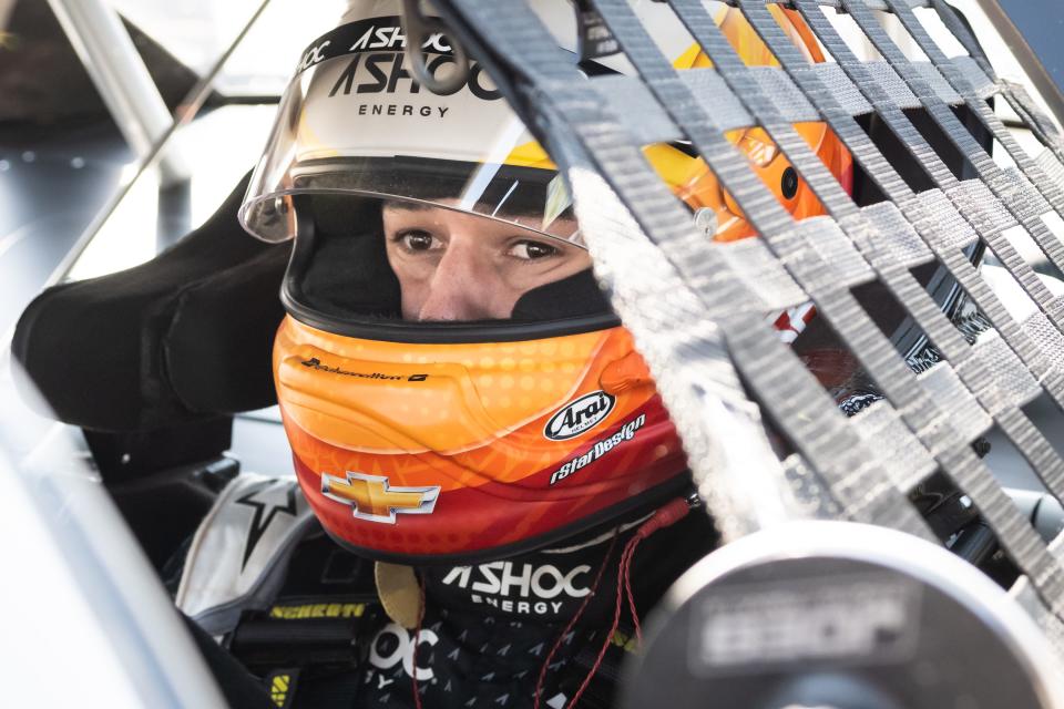 NASCAR star Chase Elliott gets situated in his car Monday for practice for his Slinger Nationals debut on Tuesday at Slinger Speedway.