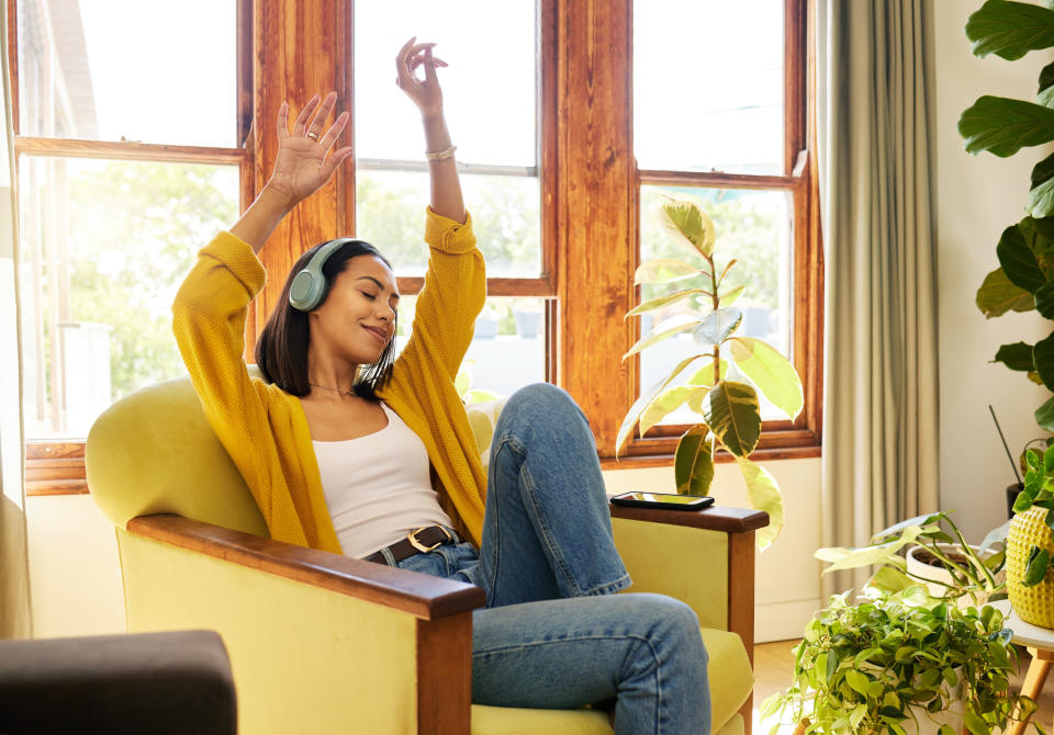 A woman sitting and dancing