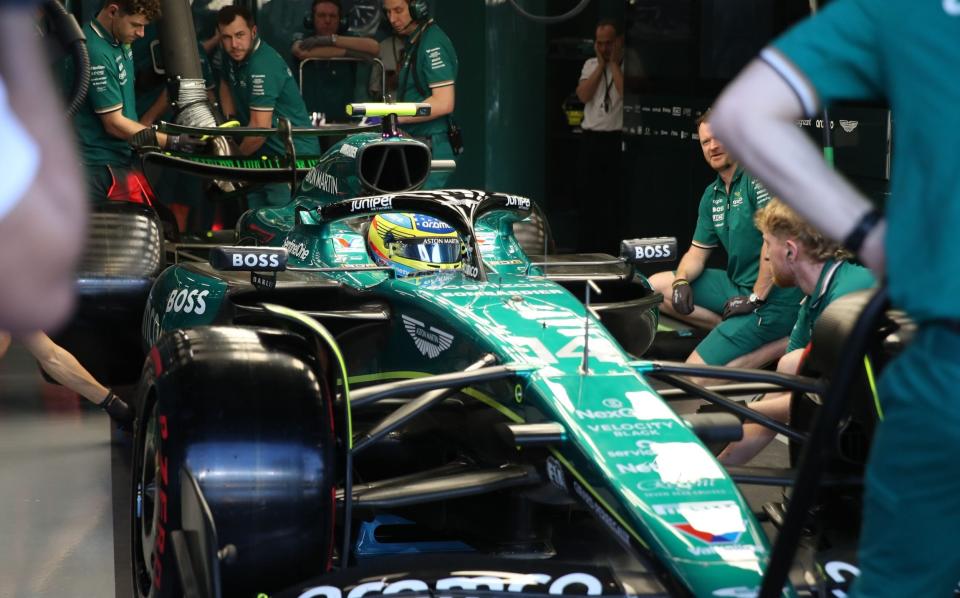 Mechanics work in the garage of Spanish driver Fernando Alonso of Aston Martin during a practice session for the Formula One Saudi Arabia Grand Prix, at the Jeddah Corniche Circuit in Jeddah