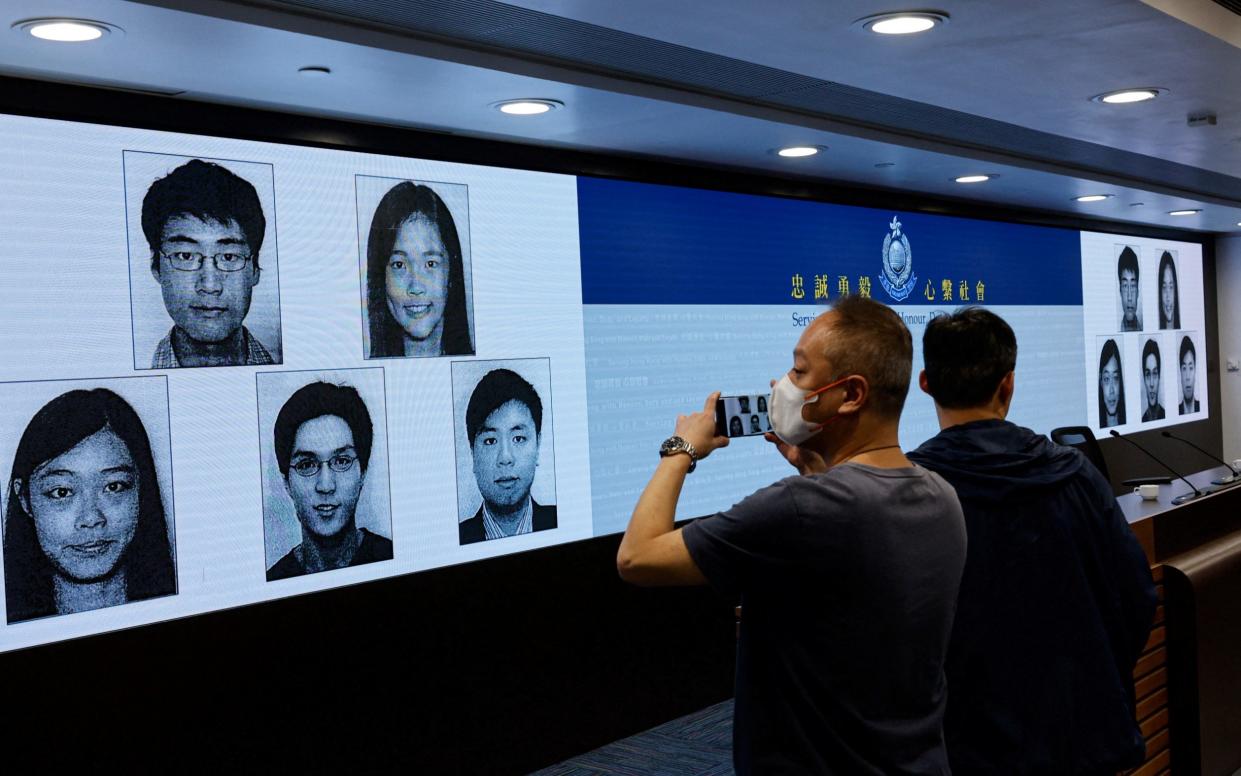 Images of the activists Simon Cheng, Frances Hui, Joey Siu, Johnny Fok, and Tony Choi  during a press conference to issue arrest warrants in Hong Kong