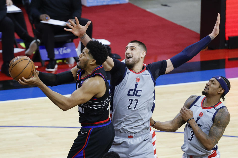 Philadelphia's Tobias Harris shoots under Washington's Alex Len during the first game of the Eastern Conference first-round series at Wells Fargo Center in Philadelphia on May 23, 2021. (Tim Nwachukwu/Getty Images)