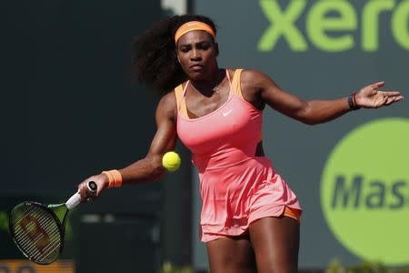 Mar 29, 2015; Key Biscayne, FL, USA; Serena Williams hits a forehand against Catherine Bellis (not pictured) on day seven of the Miami Open at Crandon Park Tennis Center. Williams won 6-1, 6-1. Mandatory Credit: Geoff Burke-USA TODAY Sports