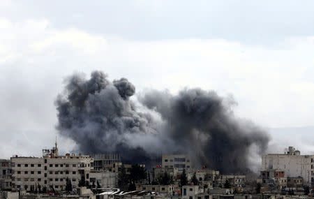 Smoke rises from the besieged Eastern Ghouta in Damascus, Syria, February 27, 2018. REUTERS/ Bassam Khabieh