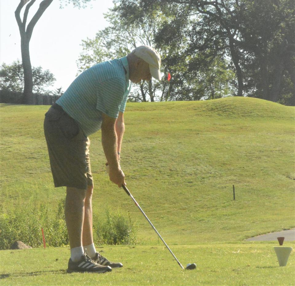 Norwich's Gary Makowicki gets ready to hit an uphill tee shot on the 13 jhole at Norwich Golf Course.