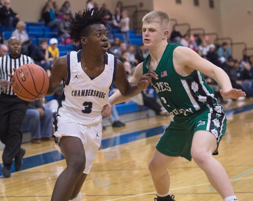 Caden Stoner, right, followed in his father's footsteps as a basketball player at James Buchanan.