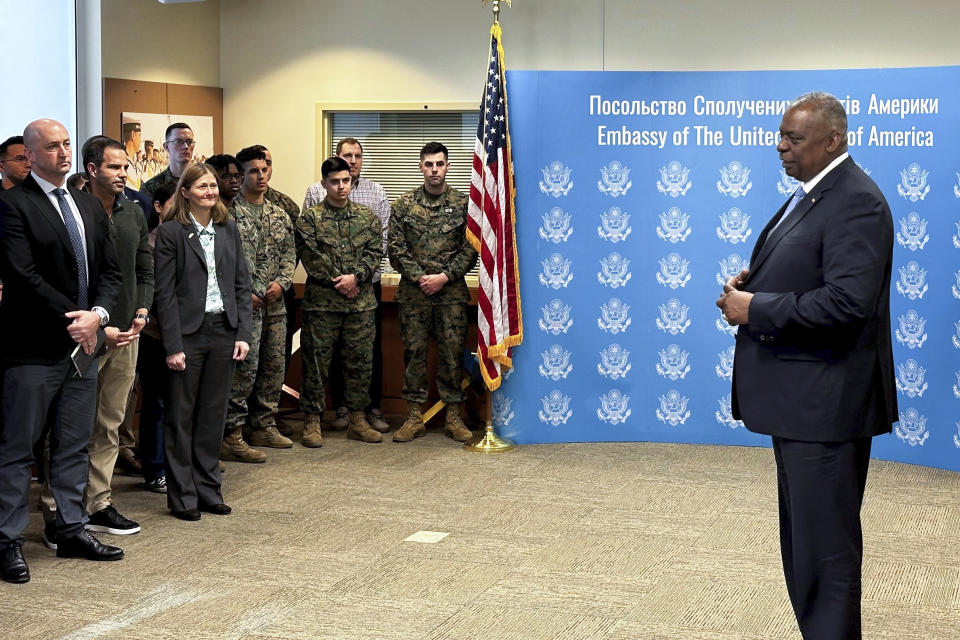 U.S. Secretary of Defense Lloyd Austin, right, speaks to employees of the U.S. embassy in Kyiv, Monday, Nov. 20, 2023, during his visit to Ukraine. Austin has made an unannounced visit to Kyiv Monday, in what is expected to be a high-profile push to keep money and weapons flowing to Ukraine even as U.S. and international resources are stretched by the new global risks raised by the Israel-Hamas conflict. (W.G. Dunlop/Pool via AP)