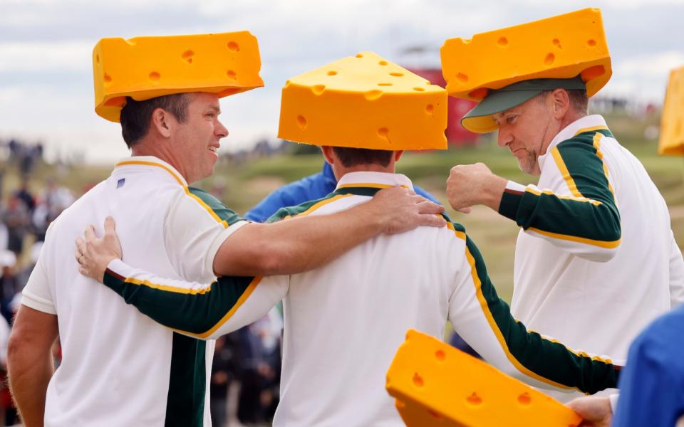 Ian Poulter (right) and Paul Casey (left) embrace the cheese - REUTERS