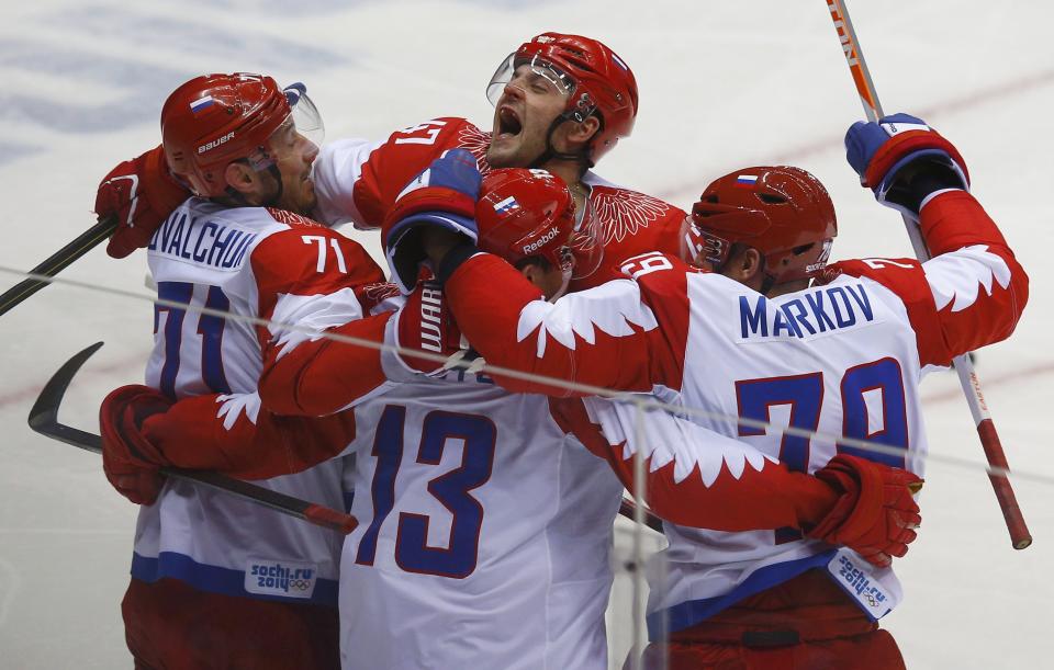 Russia's Pavel Datsyuk (13) celebrates his goal against Team USA with teammates Ilya Kovalchuk (L), Alexander Radulov (C) and Andrei Markov during the second period of their men's preliminary round ice hockey game at the Sochi 2014 Winter Olympic Games February 15, 2014. REUTERS/Brian Snyder (RUSSIA - Tags: SPORT ICE HOCKEY OLYMPICS)