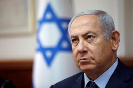 FILE PHOTO: Israeli Prime Minister Benjamin Netanyahu attends the weekly cabinet meeting at his office in Jerusalem, October 14, 2018. REUTERS/Amir Cohen