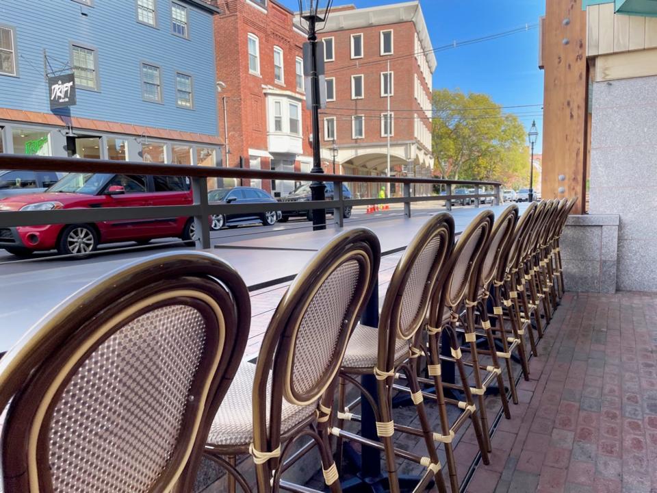 Seats line up facing Daniel Street in Portsmouth at Hearth Market food garden Wednesday, Nov. 15, 2023.