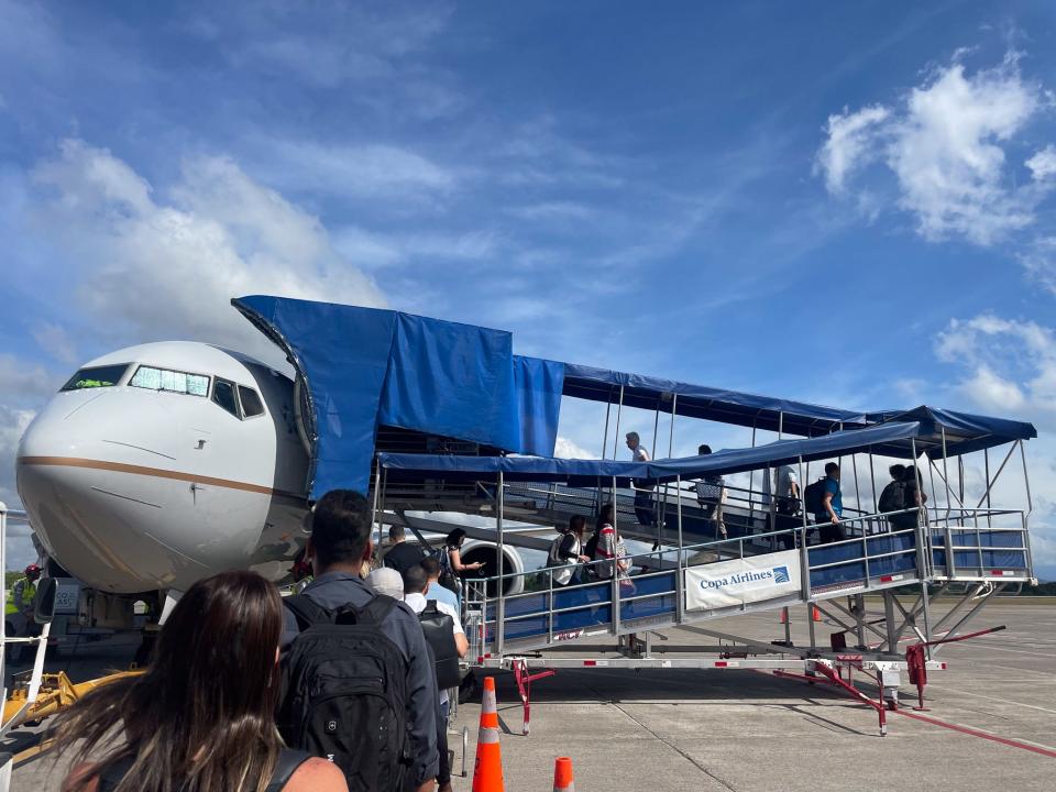 Passengers board their Copa Airlines flight.