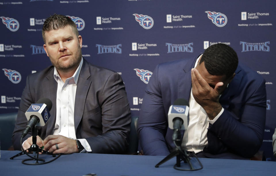 Mississippi State defensive tackle Jeffery Simmons, right, wipes tears as Tennessee Titans general manager Jon Robinson speaks about him during a news conference Friday, April 26, 2019, in Nashville, Tenn. Simmons was selected in the first round of the NFL football draft by the Titans. (AP Photo/Mark Humphrey)