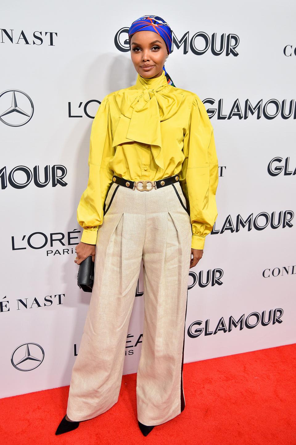 Halima Aden wearing Tory Burch