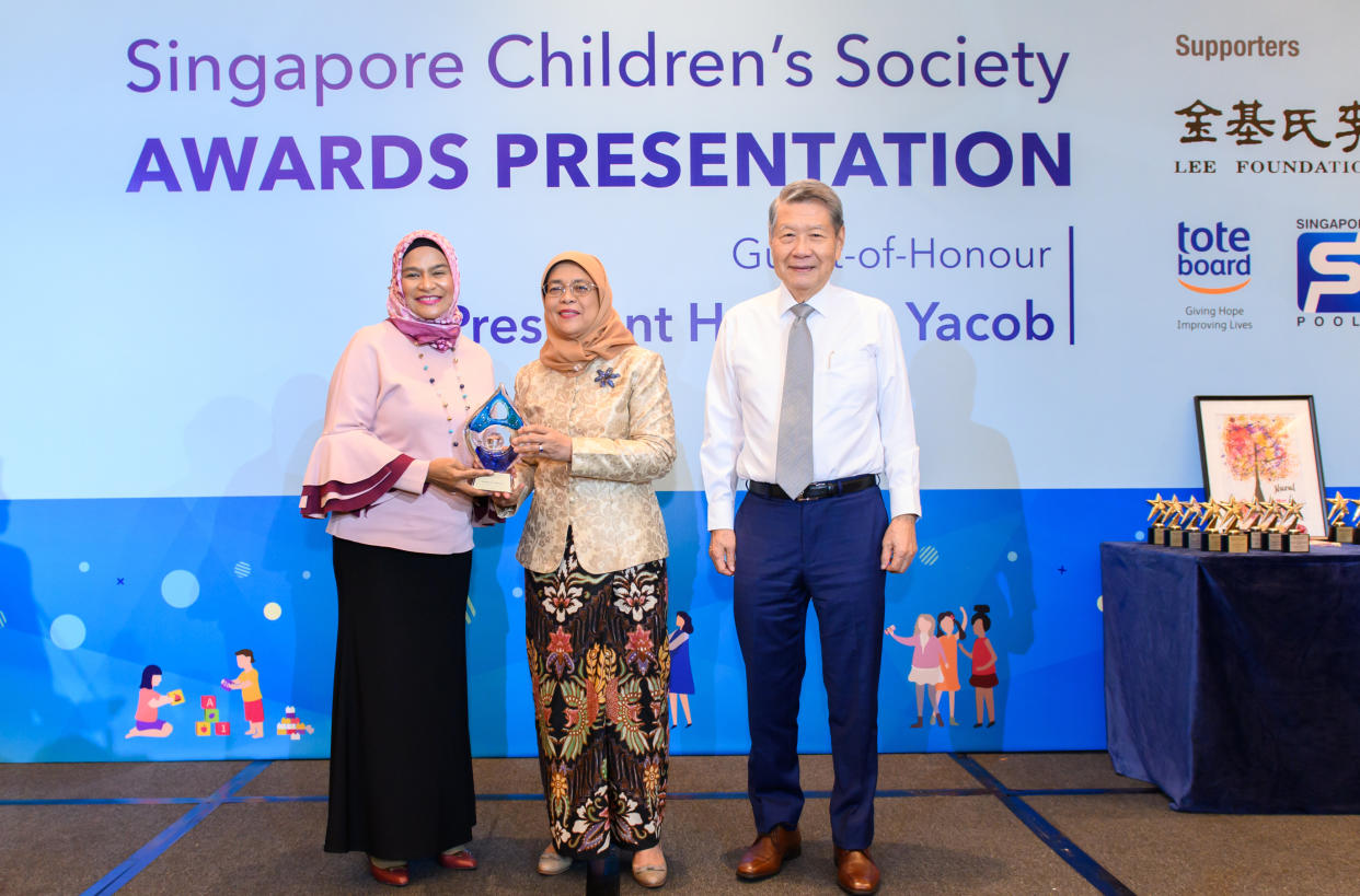 (From left to right) Rashidah Abdul Rasip was presented the prestigious Ruth Wong Award by President Halimah Yacob and SCS chairman Koh Choon Hui on 12 May, 2019. (PHOTO: SCS)