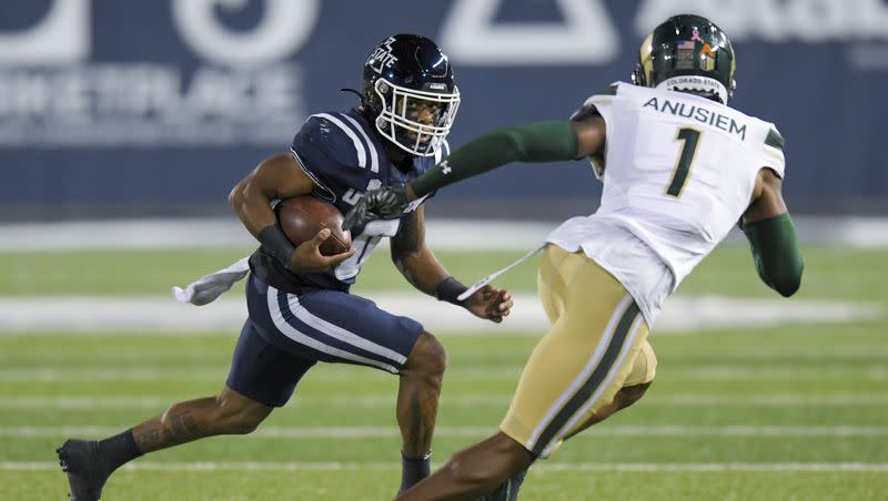 Utah State wide receiver Terrell Vaughn (0) runs downfield as Colorado State defensive back Chigozie Anusiem (1) defends during the first half of an NCAA college football game Saturday, Oct. 7, 2023, in Logan, Utah. 