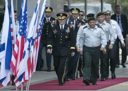 Chairman of the Joint Chiefs of Staff U.S. Army General Martin Dempsey, is escorted by Israel's Chief of Staff Lieutenant General Gadi Eizenkot (front R) during a welcoming ceremony for Dempsey in Tel Aviv June 9, 2015. REUTERS/Baz Ratner