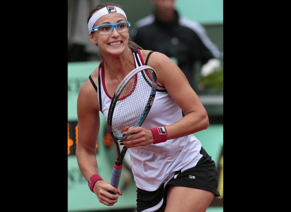 Kazkhstan's Yaroslava Shvedova hits a return to Czech Republic's Petra Kvitova during their women's quarterfinal tennis match of the French Open in Paris.      (JACQUES DEMARTHON/AFP/GettyImages)