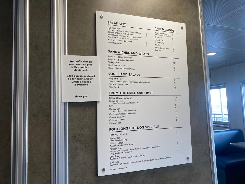 menu on a wall in a cafe on a ferry