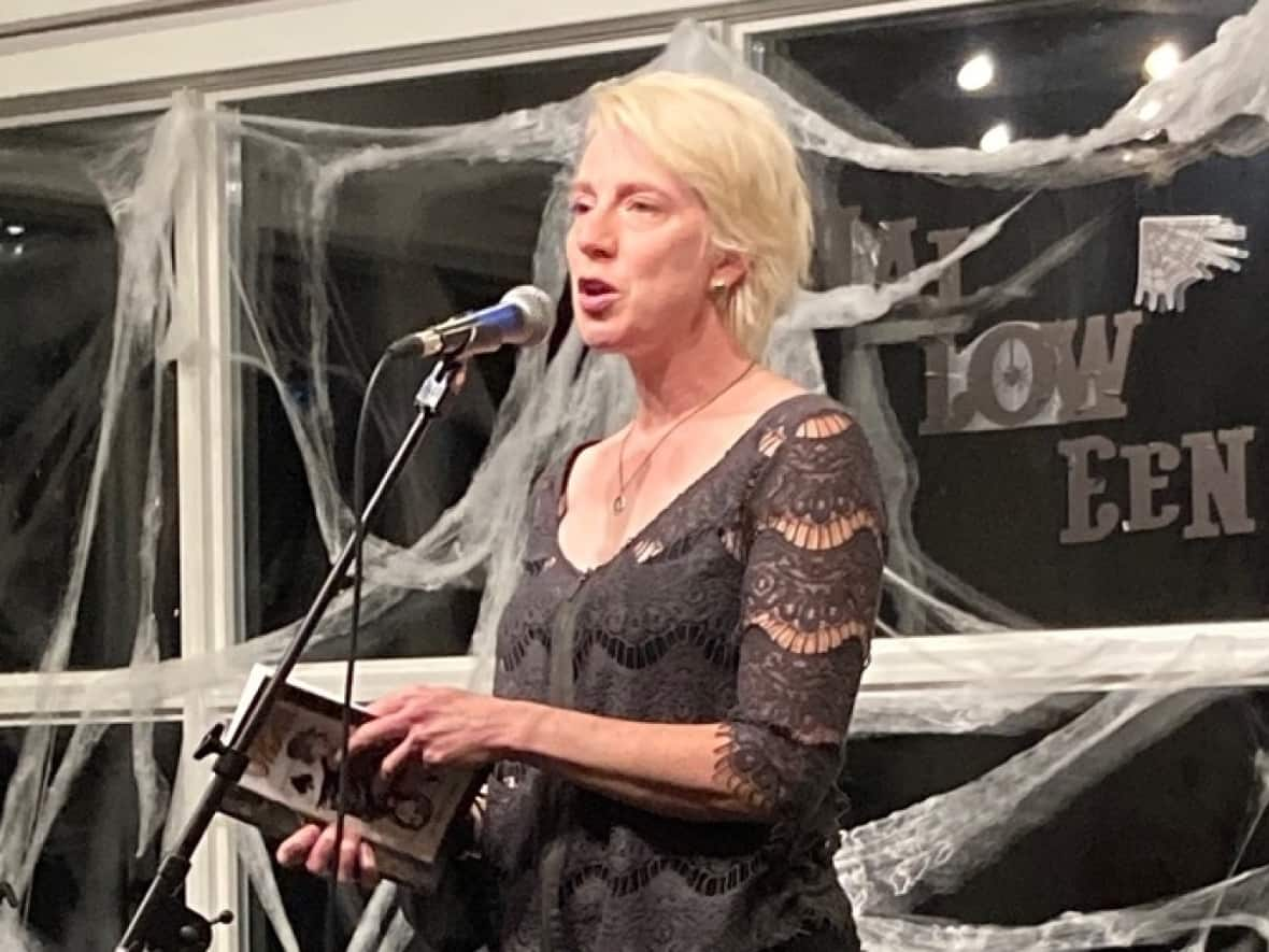 Kate Story reads from Urchin at the book's launch in St. John’s in October. 'I hope there’s room in the text for people of different identities to find a little glimpse of their experience,' says Story. (Marnie Parsons/Submitted by Lynette Adams - image credit)