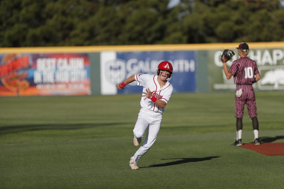 Albany’s Cooper Fairchild (1) rounds second base in the second inning.