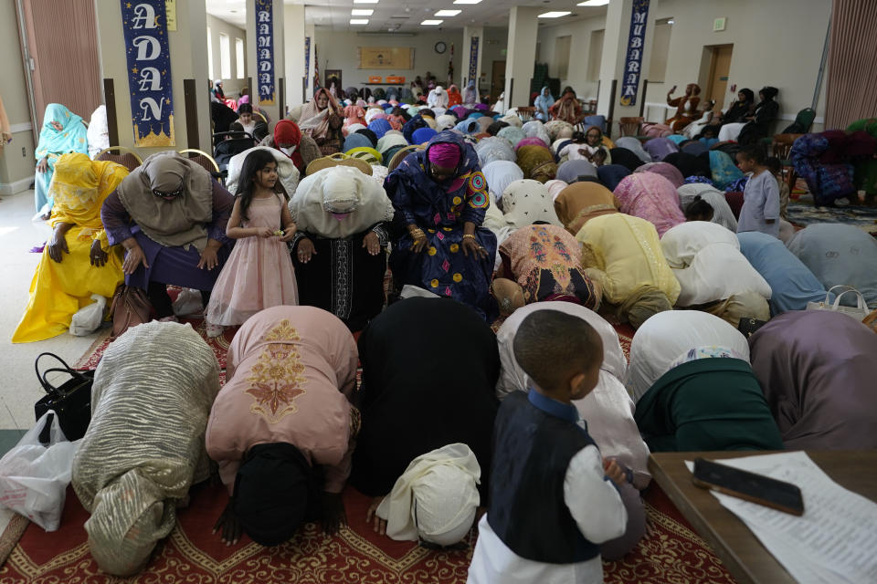 Women pray during Eid al-Fitr, Friday, April 21, 2023, at the Muslim Community Center in Silver Spring, Md. Eid al-Fitr marks the end of the Muslim holy fasting month of Ramadan. (AP Photo/Carolyn Kaster)