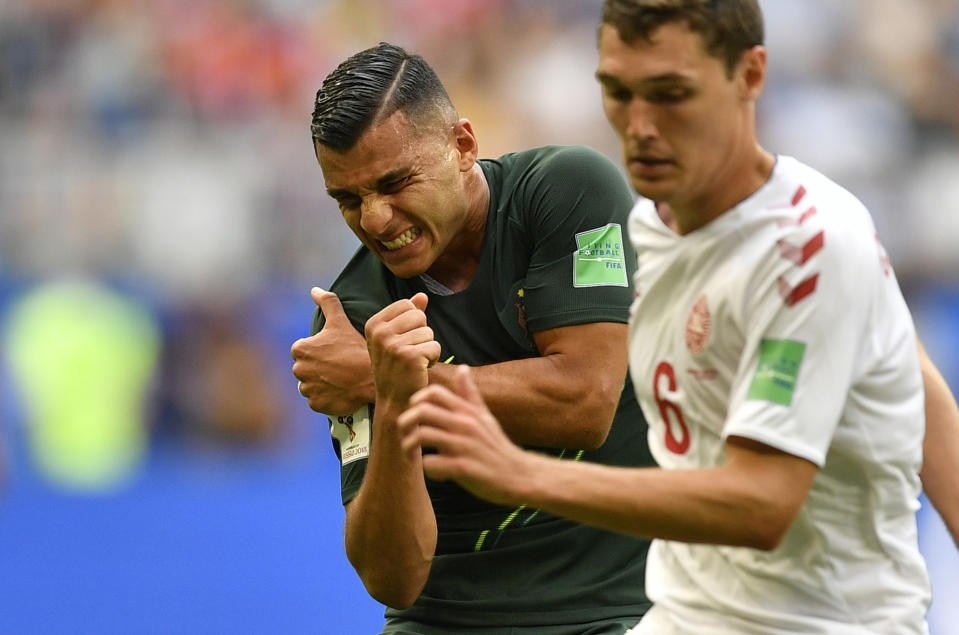 <p>Australia’s Andrew Nabbout grimaces in pain after suffering a shoulder injury during the group C match between Denmark and Australia at the 2018 soccer World Cup in the Samara Arena in Samara, Russia, Thursday, June 21, 2018. (AP Photo/Martin Meissner) </p>