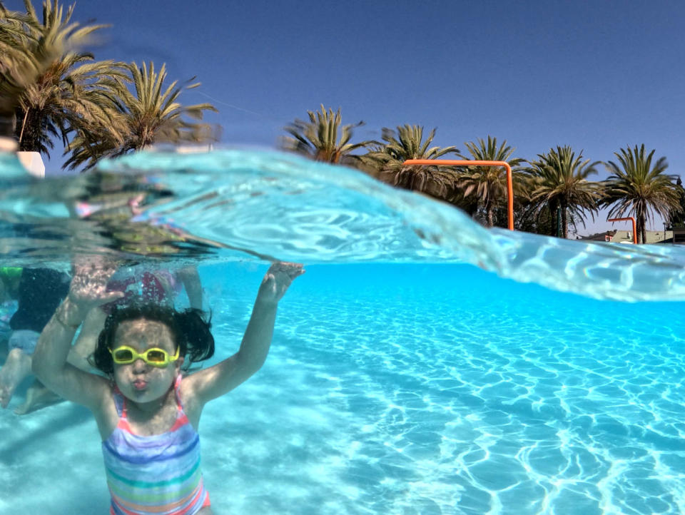 Image: A child takes free swimming lessons in Los Angeles on July 6. (Allen J. Schaben / Los Angeles Times via Getty Images file)