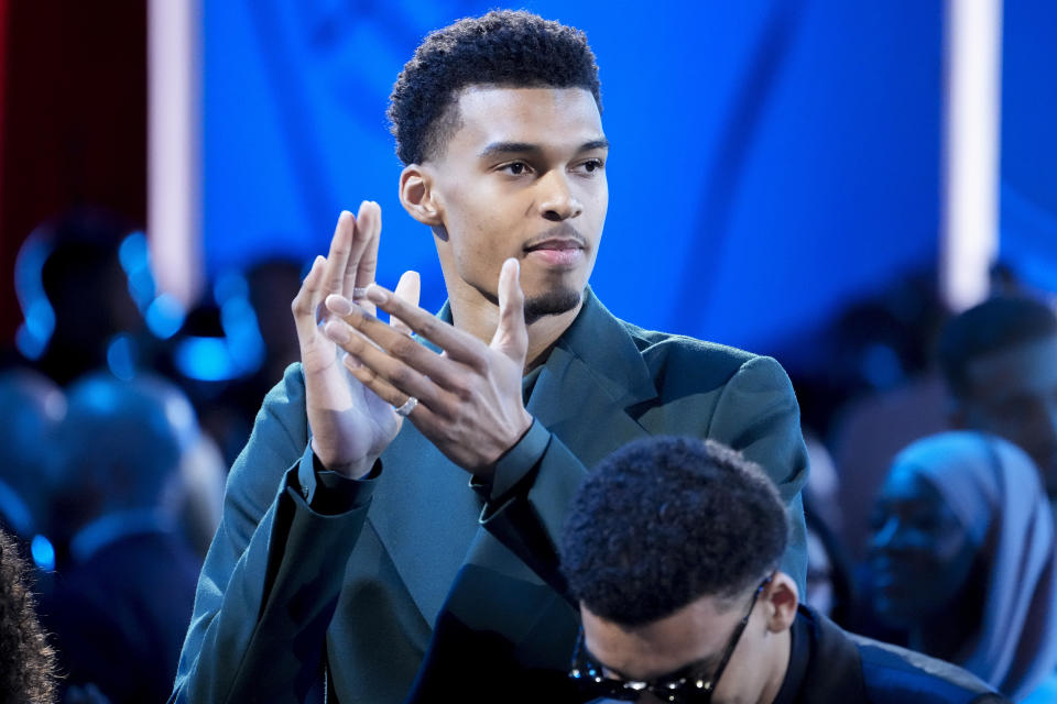 Victor Wembanyama reacts during introductions before the NBA basketball draft, Thursday, June 22, 2023, in New York. (AP Photo/John Minchillo)