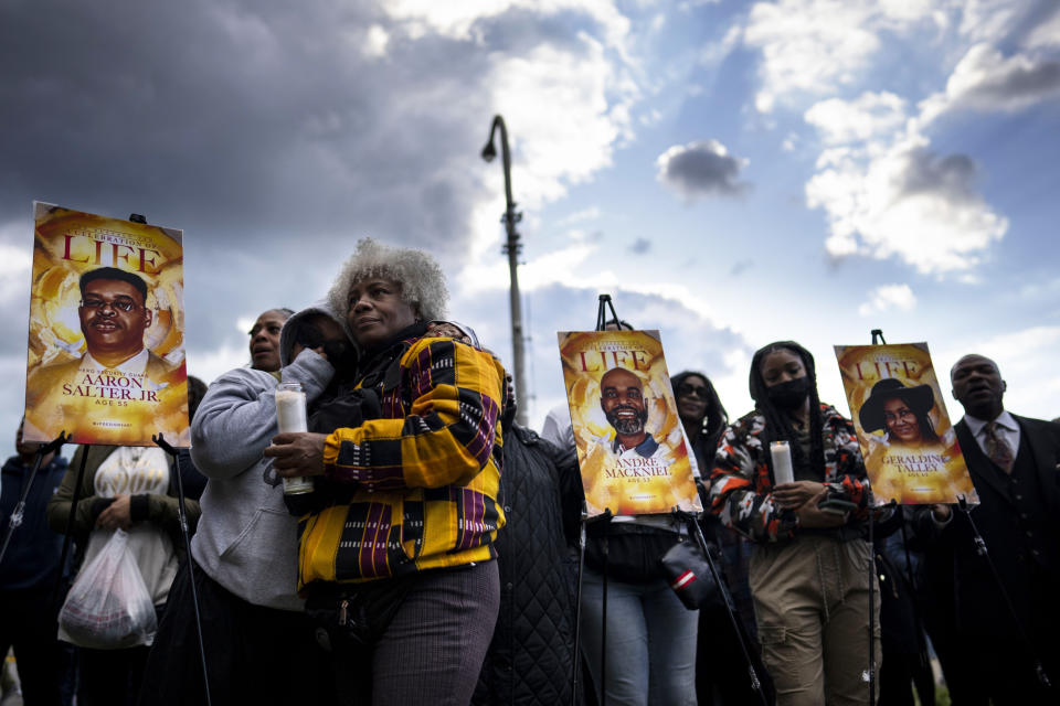 People attend a vigil across the street from Tops Friendly Market  (Kent Nishimura / Los Angeles Times via Getty Images file)