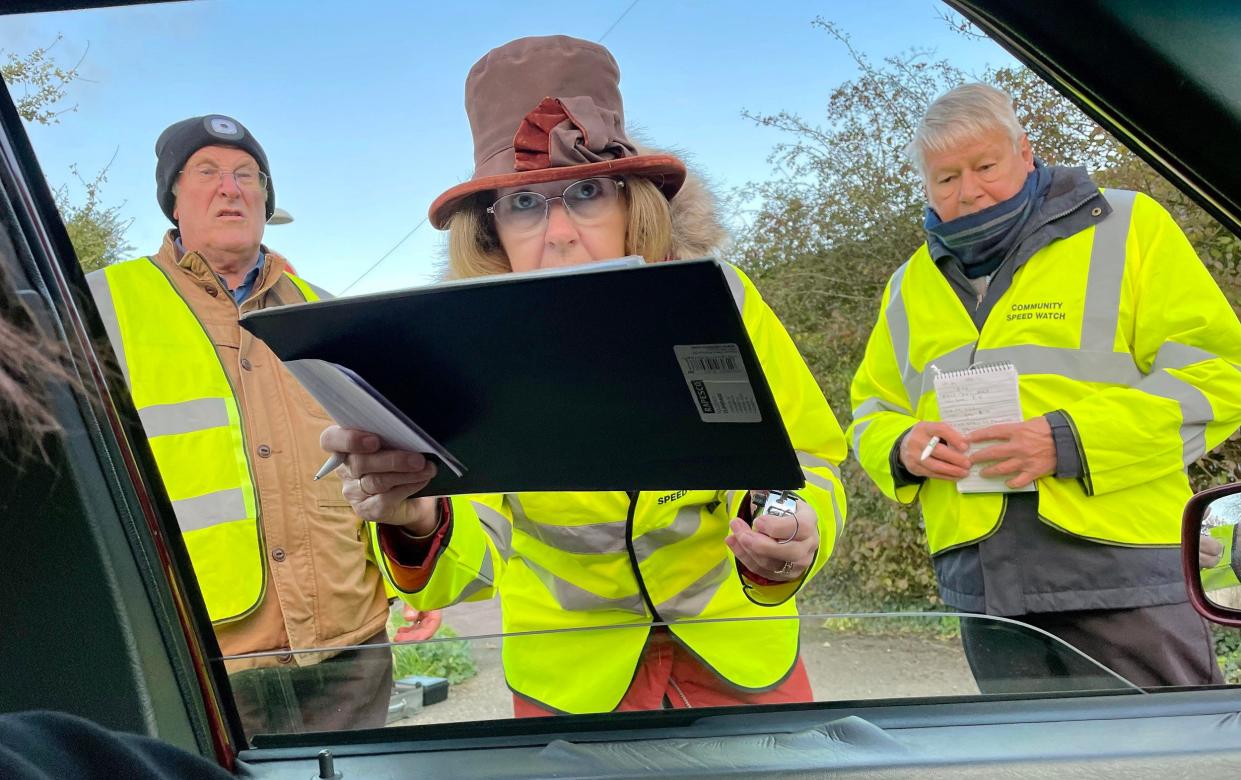 Phil Dewhurst took this photo of the speed watch volunteers, who he described as 'aggressive and over-zealous' - BNPS