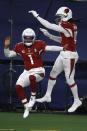 Arizona Cardinals' Kyler Murray (1) and DeAndre Hopkins (10) celebrate a touchdown scored on a carry by Murray in the second half of an NFL football game against the Dallas Cowboys in Arlington, Texas, Monday, Oct. 19, 2020. (AP Photo/Ron Jenkins)