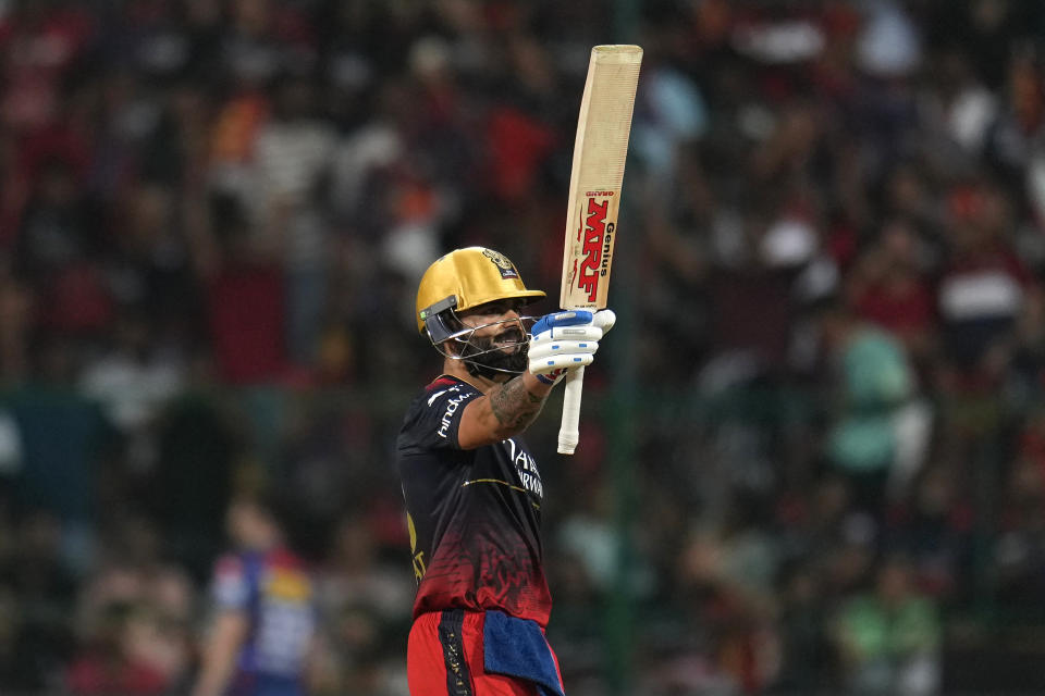 Royal Challengers Bangalore's Virat Kohli celebrates scoring fifty runs during the Indian Premier League cricket match between Royal Challengers Bangalore and Lucknow Super Giants in Bengaluru, India, Monday, April 10, 2023. (AP Photo/Aijaz Rahi)