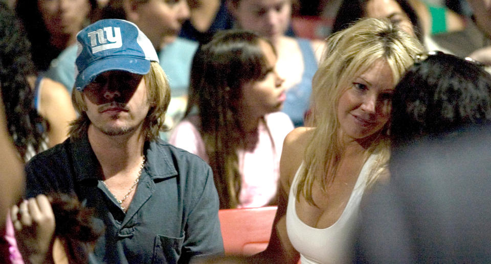 David Spade and Heather Locklear attend a Go-Go's concert on July 14, 2006, in L.A. (Photo: J. Strauss/FilmMagic)