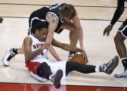 Toronto Raptors guard DeMar DeRozan (10) vies for the ball against Brooklyn Nets forward Andrei Kirilenko during the first half of Game 2 in an NBA basketball first-round playoff series, Tuesday, April 22, 2014, in Toronto. (AP Photo/The Canadian Press, Nathan Denette)