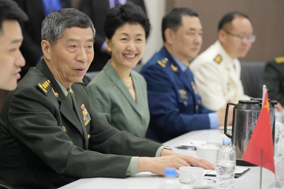 Chinese Defense Minister Gen. Li Shangfu, left, talks during a meeting with Singapore Defense Minister Ng Eng Hen, unseen, at the defense ministry in Singapore, Thursday, June 1, 2023. China and Singapore laid the groundwork Friday for a hotline between the two countries that would establish a high-level communications link between Beijing and a close American partner in Asia at a time when Chinese tensions with Washington are high and dialogue has stalled. (AP Photo/Vincent Thian)