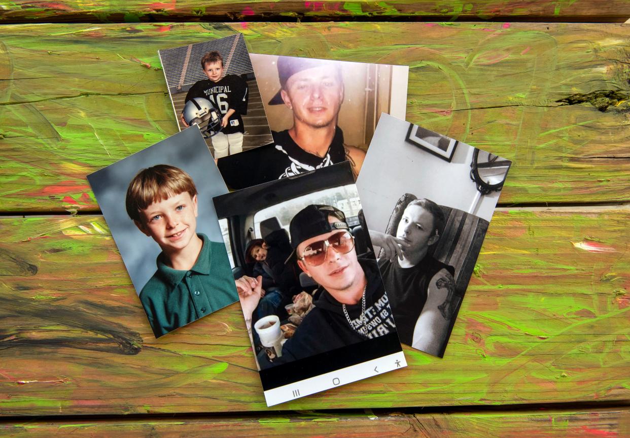 Childhood photos of Chadrick Wade lie on a picnic table at Semmes Municipal Park in Semmes, Alabama, on Aug. 7, 2022. Chadrick Wade died July 4 in the Fountain Correctional Facility where he was serving 15 years. He made repeated requests to prison officials for mental health care to no avail.