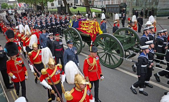 <div class="inline-image__caption"><p>The State Gun Carriage carries the coffin of Queen Elizabeth II, draped in the Royal Standard with the Imperial State Crown and the Sovereign's orb and scepter, as it makes its way for the State Funeral at Westminster Abbey, London on September 19, 2022.</p></div> <div class="inline-image__credit">MARC ASPLAND/POOL/AFP via Getty Images</div>